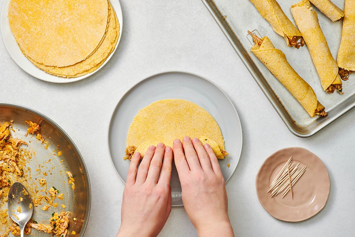 Assembling the pork taquitos 