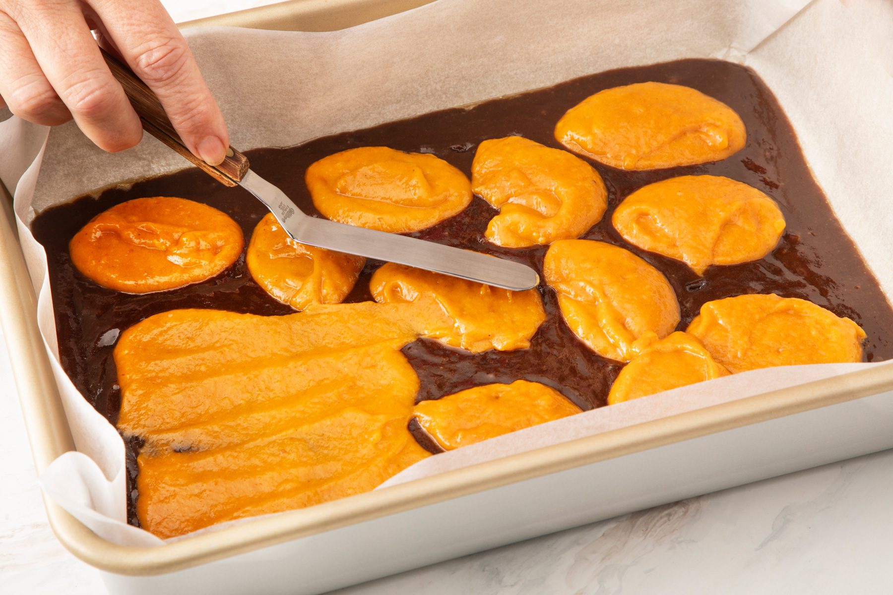 Spreading pumpkin batter 