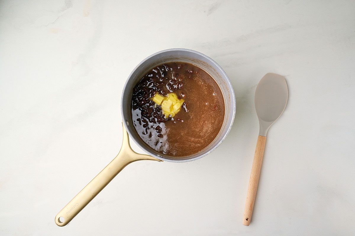 Stirring the sugar, flour, raisins, cinnamon, and butter to create the filling for Raisin Pie. Taste of Home recipe