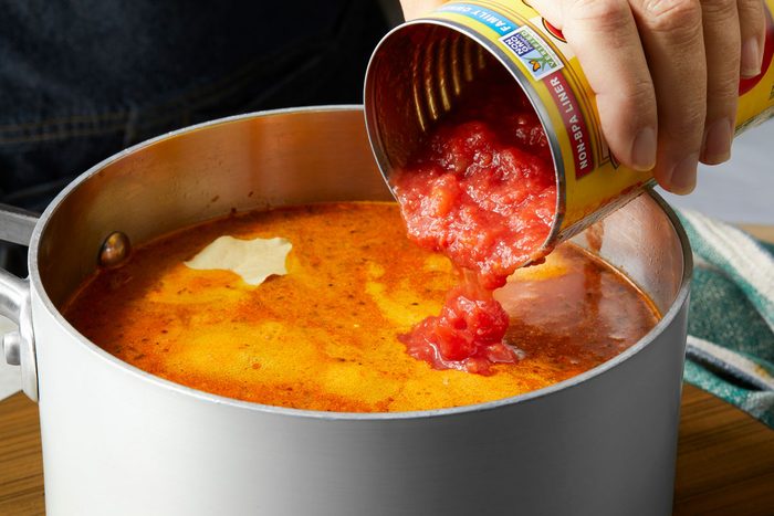 Add tomatoes and bay leaf