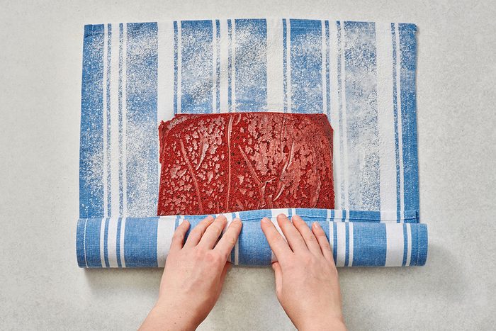 Rolling up the cake in a towel jelly-roll style