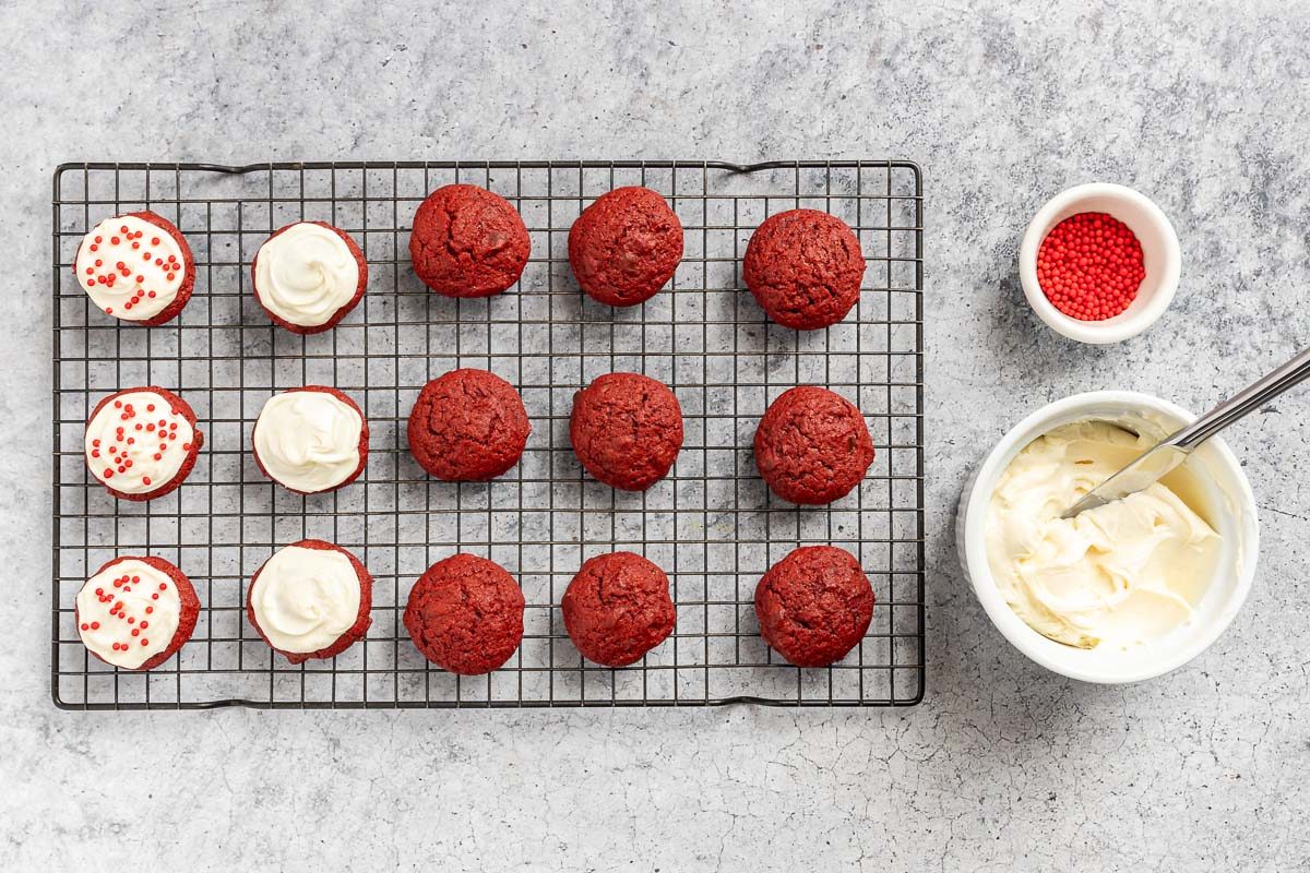 baked cookies being frosted and decorated