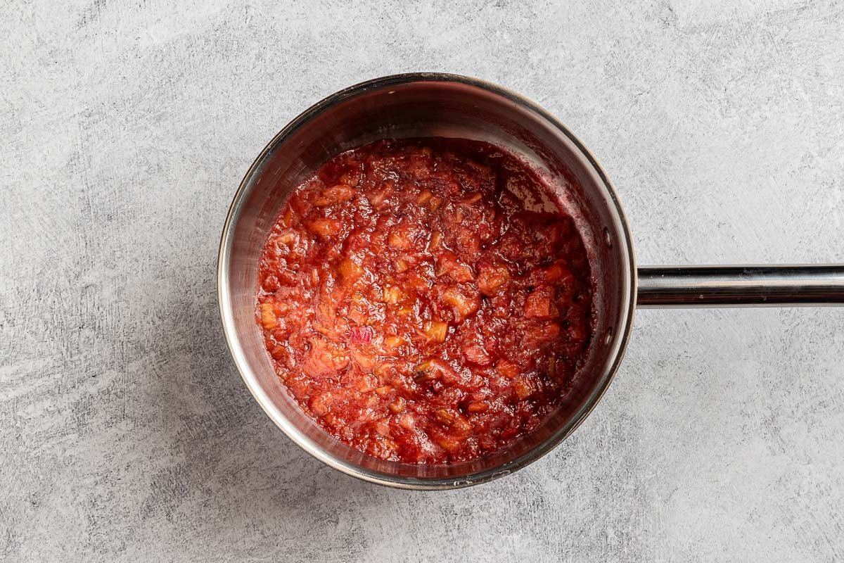 cooked rhubarb in the saucepan with the simple syrup.