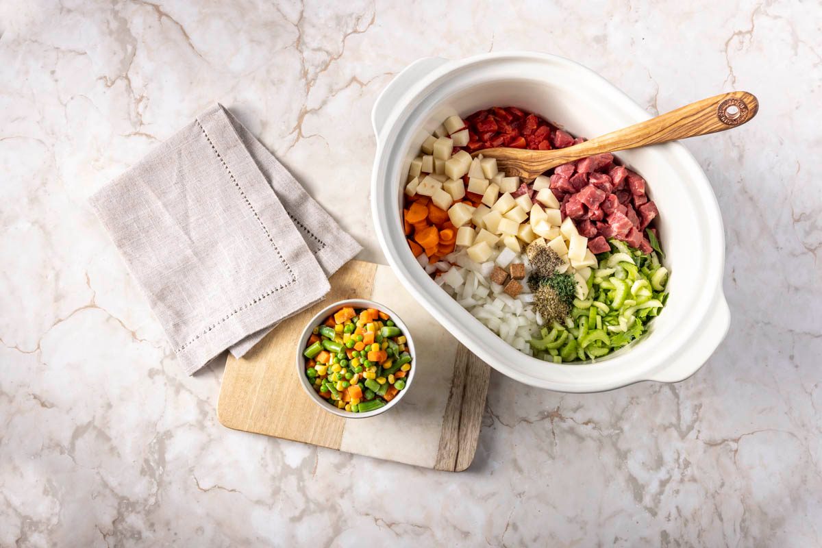 ingredients in a slow cooker for Slow Cooker Vegetable Soup