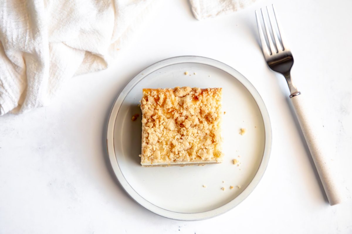 Overhead shot for Taste of Home Snickerdoodle Cheesecake Bars being served on a plate.