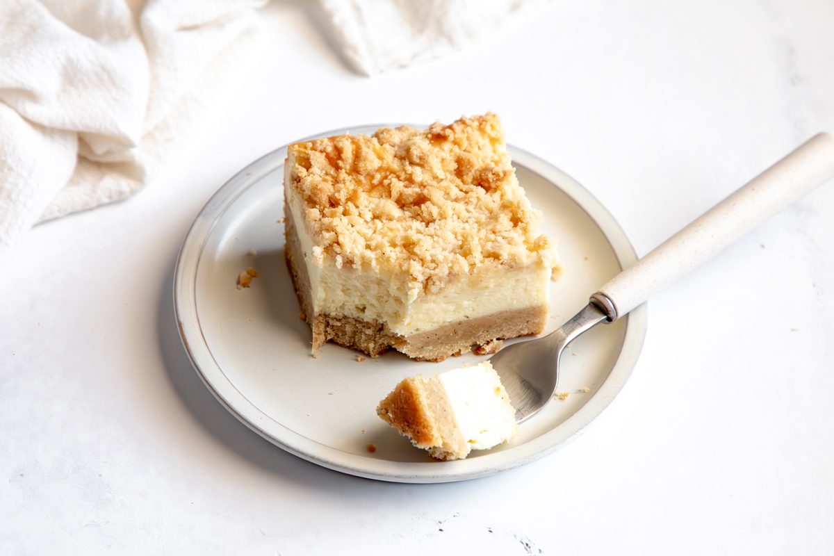 Close up beauty shot for Taste of Home Snickerdoodle Cheesecake Bars being served on a plate.