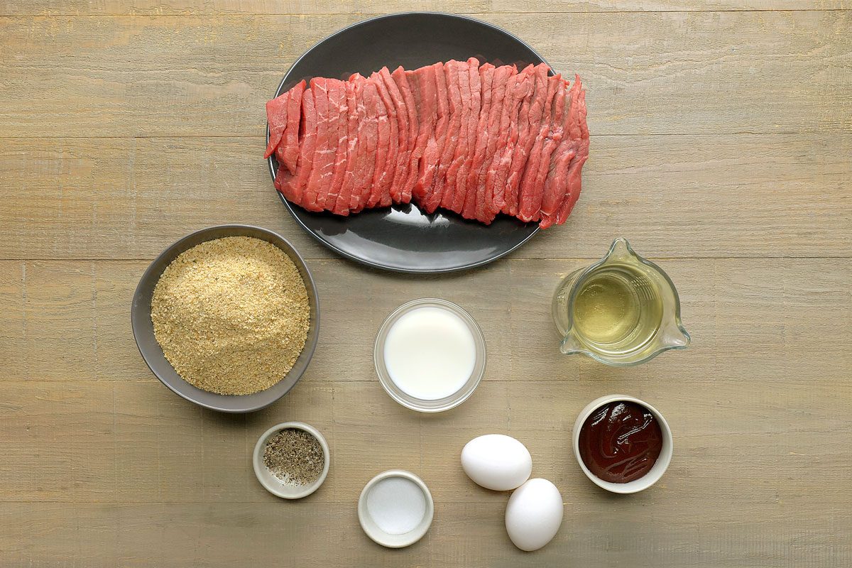 Overhead Shot Of Steak Fingerss Ingredients on a Wooden Surface