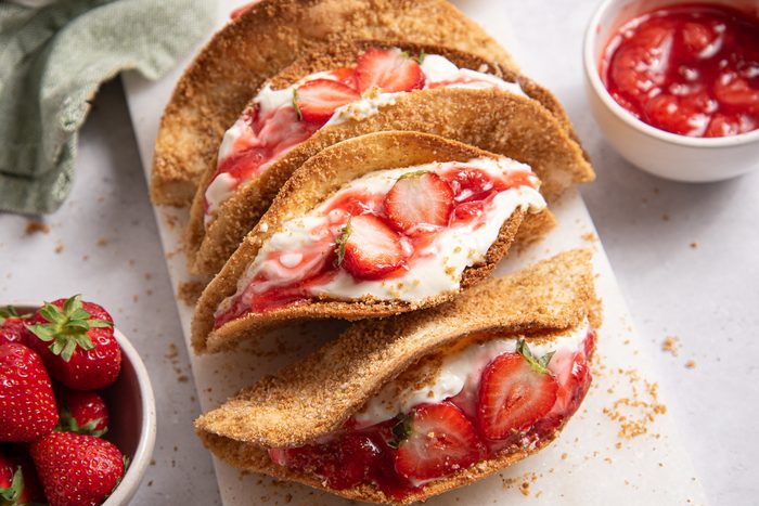 Straberry Cheesecake Tacos On Marble Board
