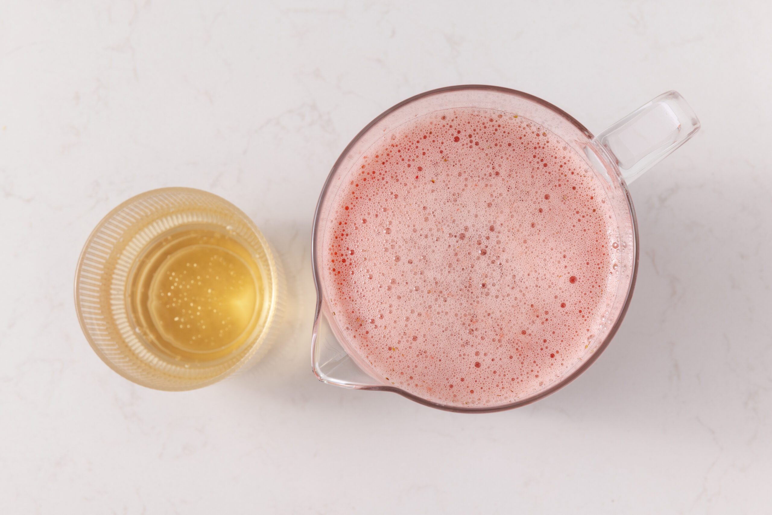 Strawberry drink mixture ready to be combined with ginger ale.