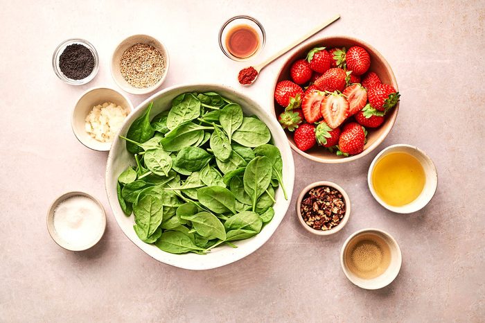Ingredients of Strawberry Spinach Salad in bowls, recipe by Taste of Home