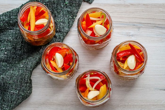 Filling jars for pickled sweet peppers, a recipe from Taste of Home.