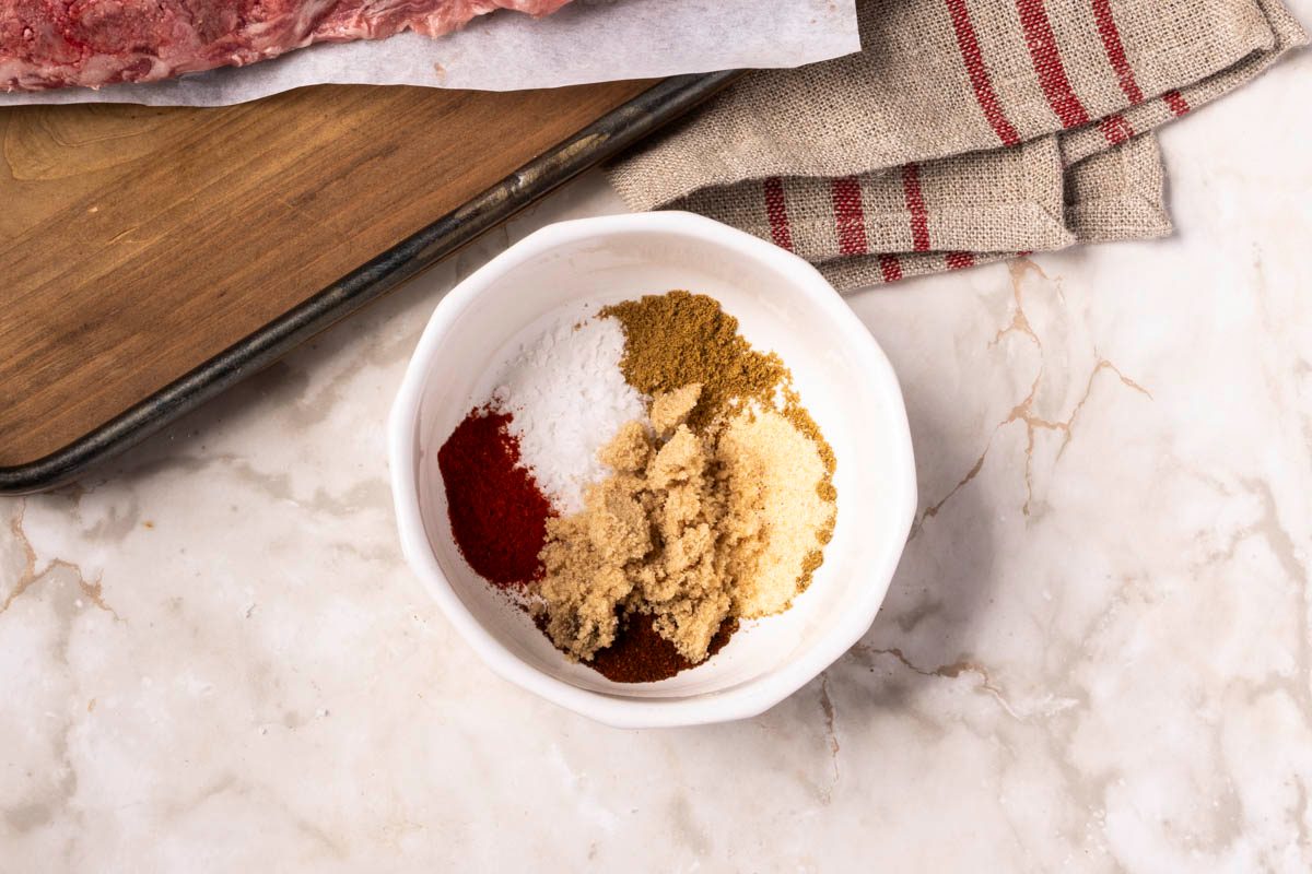 preparing Air-Fryer Pork Ribs next to seasoning on marble table shot at over head