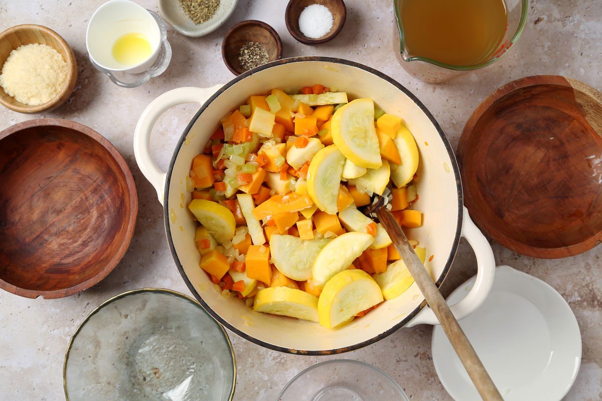 Process of making Taste of Home's butternut squash and sweet potato soup laid out on a brown marble surface.