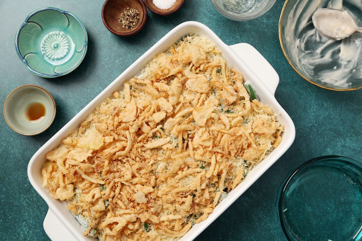 Process of making Taste of Home's Gluten Free Green Bean Casserole in a white casserole dish on a teal surface.