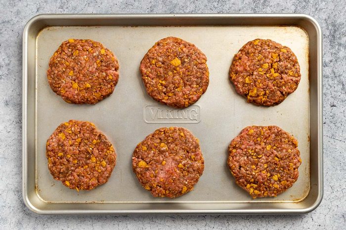 the prepared patties on a baking sheet