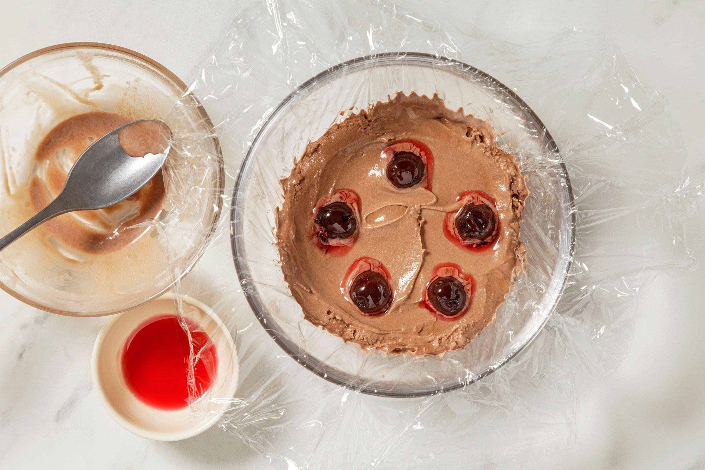 Cherries placed on chocolate ice cream