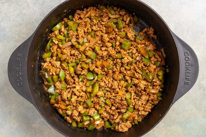 Taste of Home Turkey Black Bean Chili photo of the cooked turkey, onion, green pepper and spices.