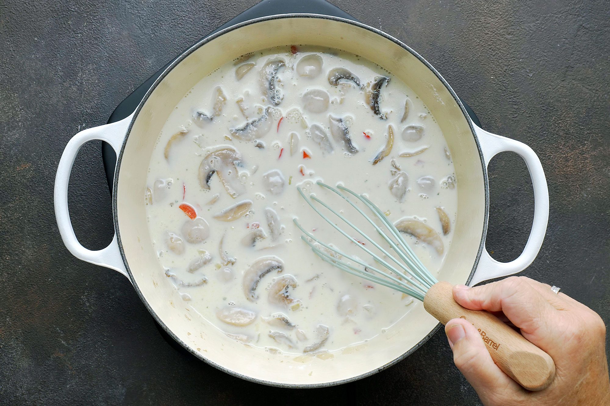 Gradually whisk in milk and bouillon. Bring to a boil;