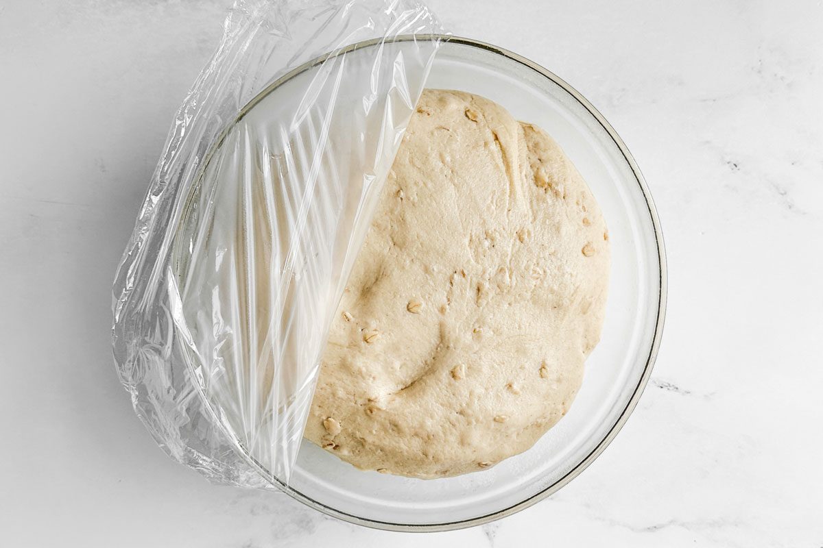Dough for Taste of Home Whole Wheat Rolls in a glass bowl