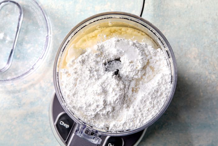 Confectioners' sugar on processed almond paste