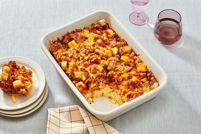 Sausage strata in a baking dish with one portion removed
