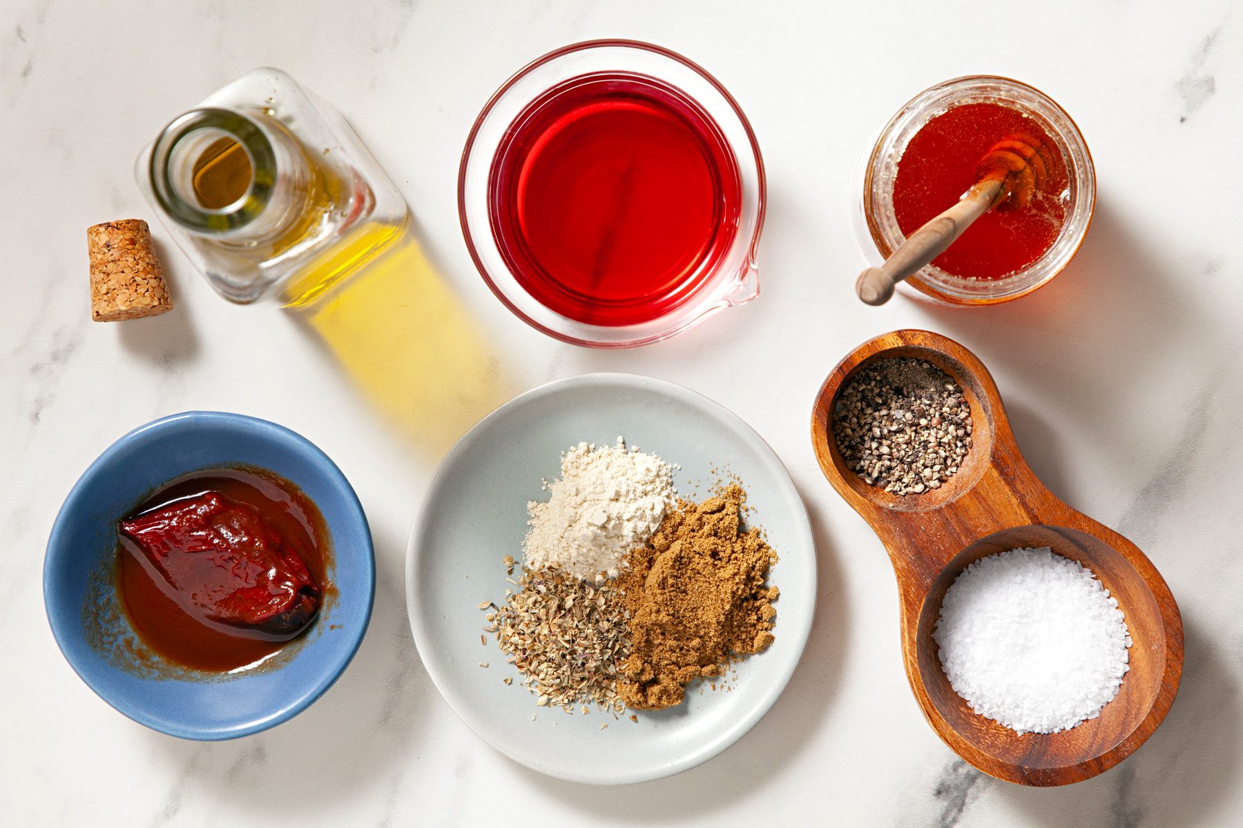 Overhead shot of various ingredients arranged on a marble countertop