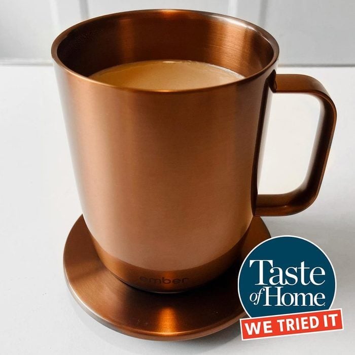 Copper Colored Ember Mug On Coaster Filled With Coffee Ss Edit