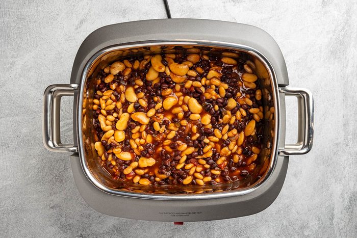 Taste of Home Crockpot Baked Beans recipe photo of all the ingredients cooked in the crockpot.