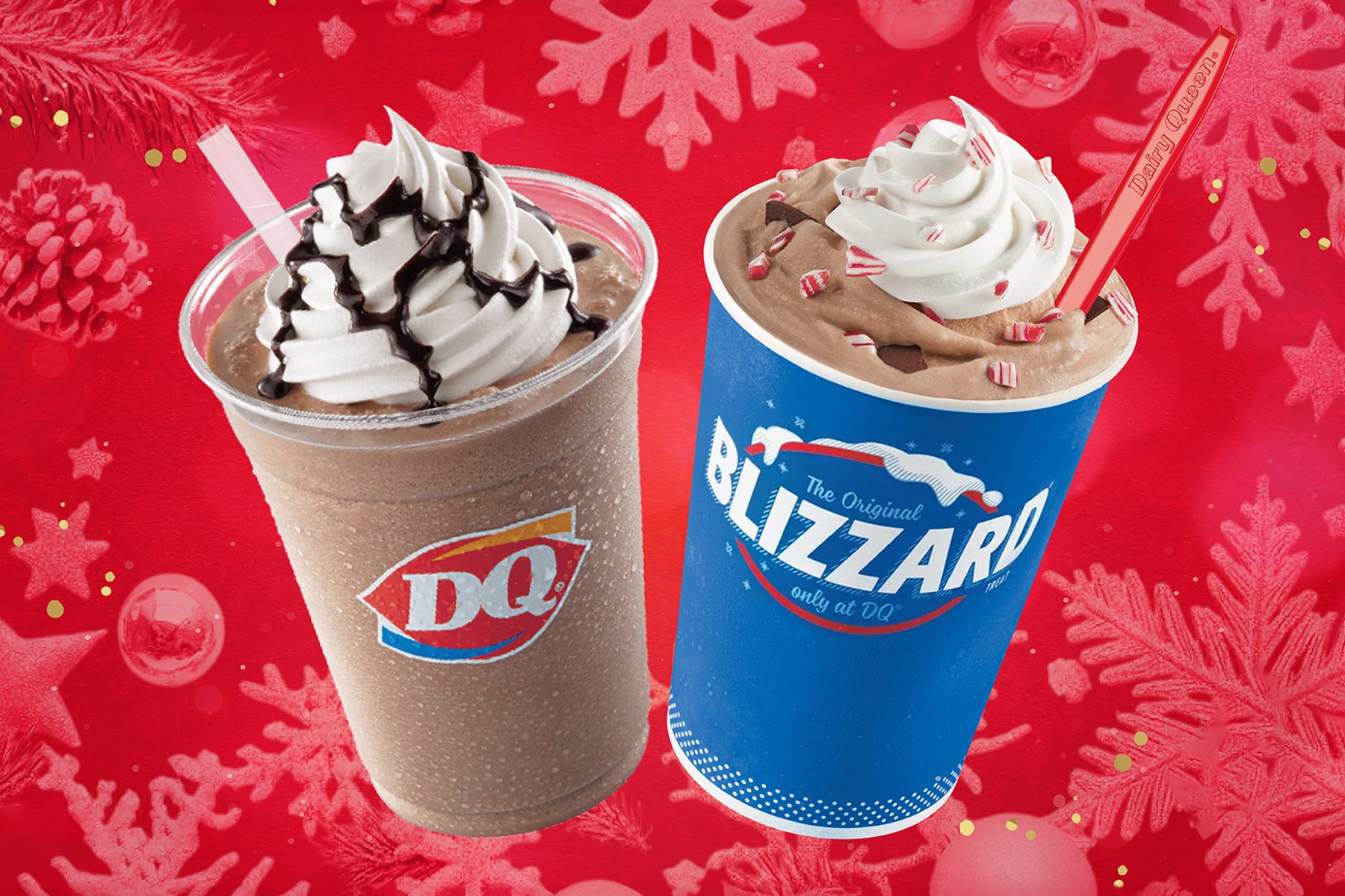 Two Dairy Queen beverages are shown: a clear cup with chocolate drizzle and whipped cream, and a blue Blizzard cup with whipped topping and crushed red candies. The background is red with snowflakes and ornament designs.