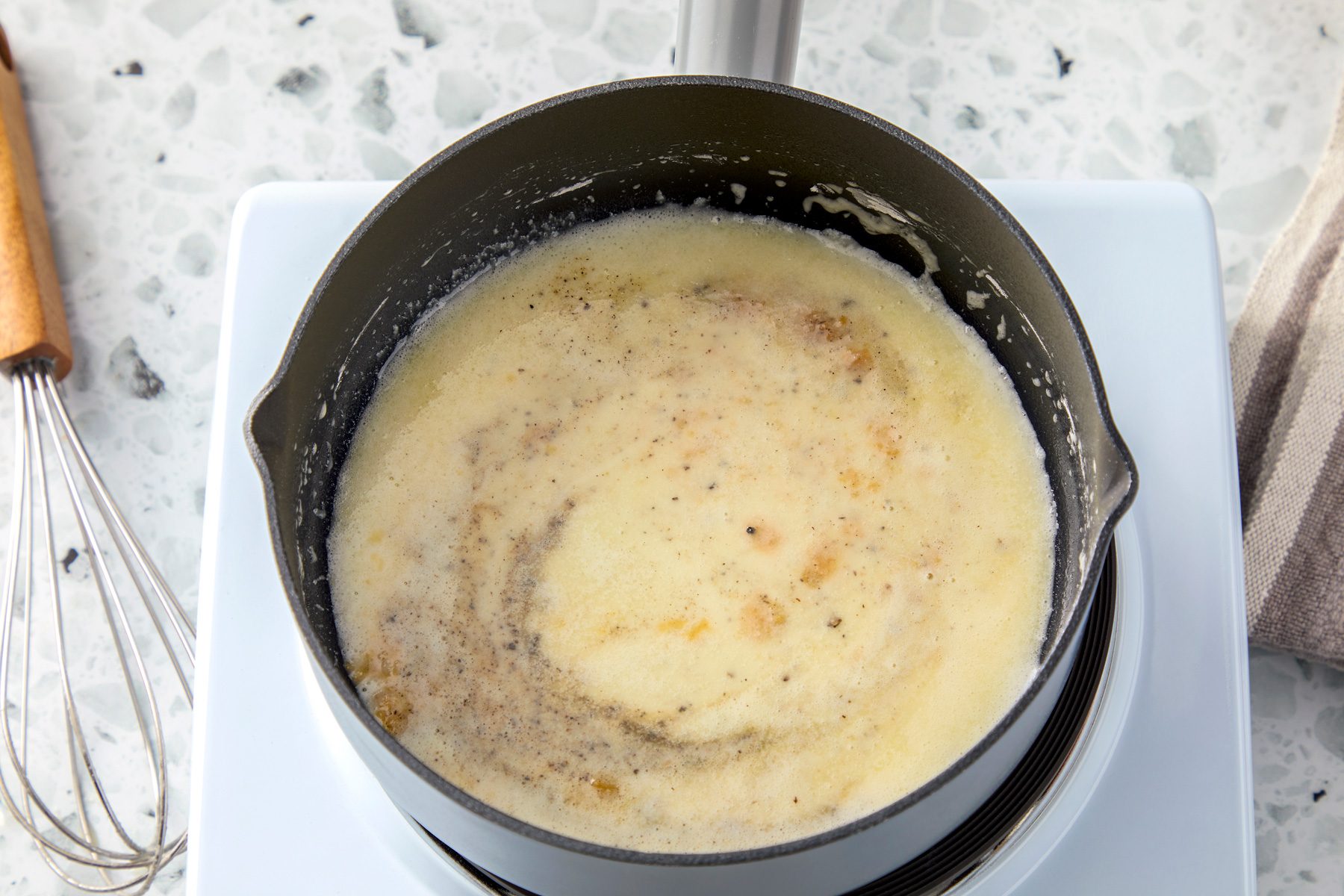 Whisk in salt, pepper, garlic powder, and onion powder.