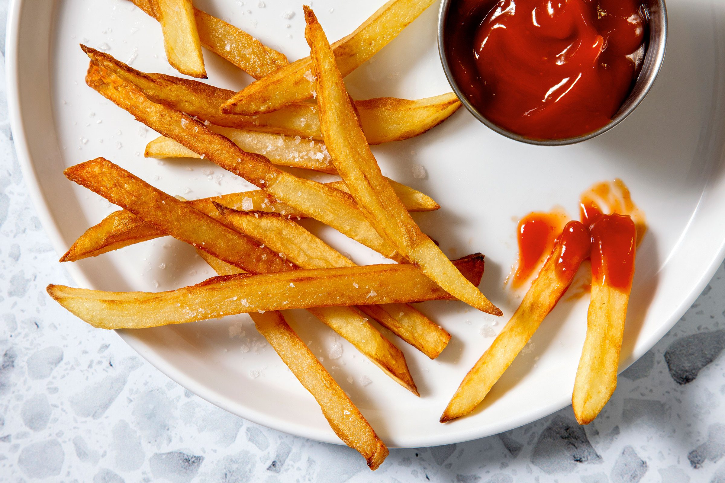 Pan Fried French Fries with ketchup on side