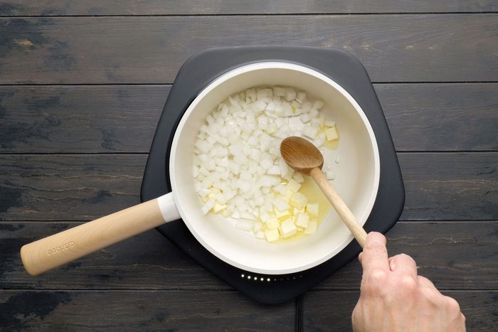 Sautéing onion and butter in a pan