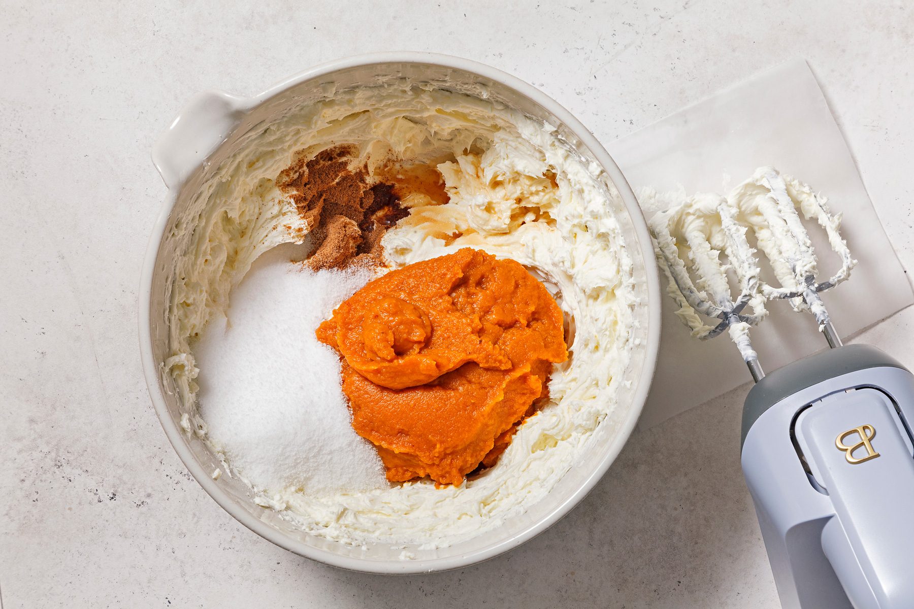 In a large bowl, beat cream cheese at medium speed until fluffy. Beat in sugar substitute, canned pumpkin pie spice.