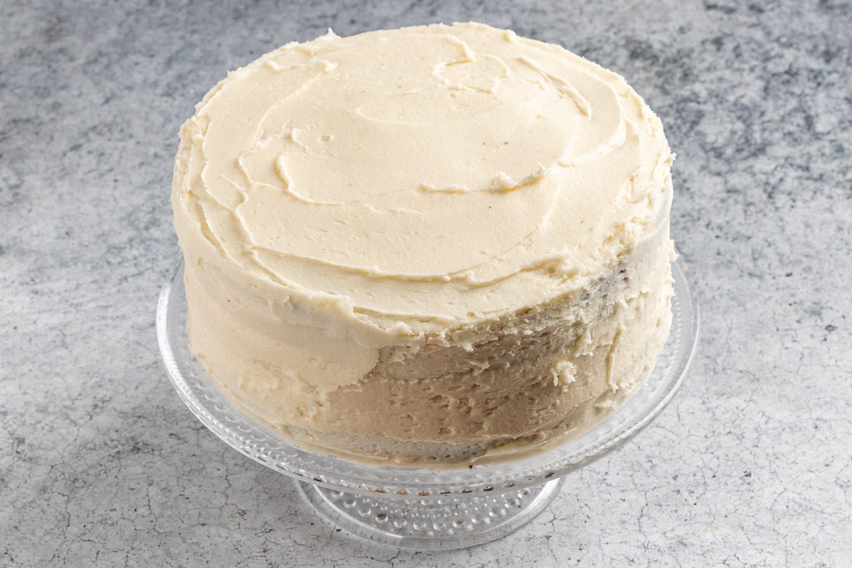 Taste of Home Marble Cake photo of assembling and frosting the cake.