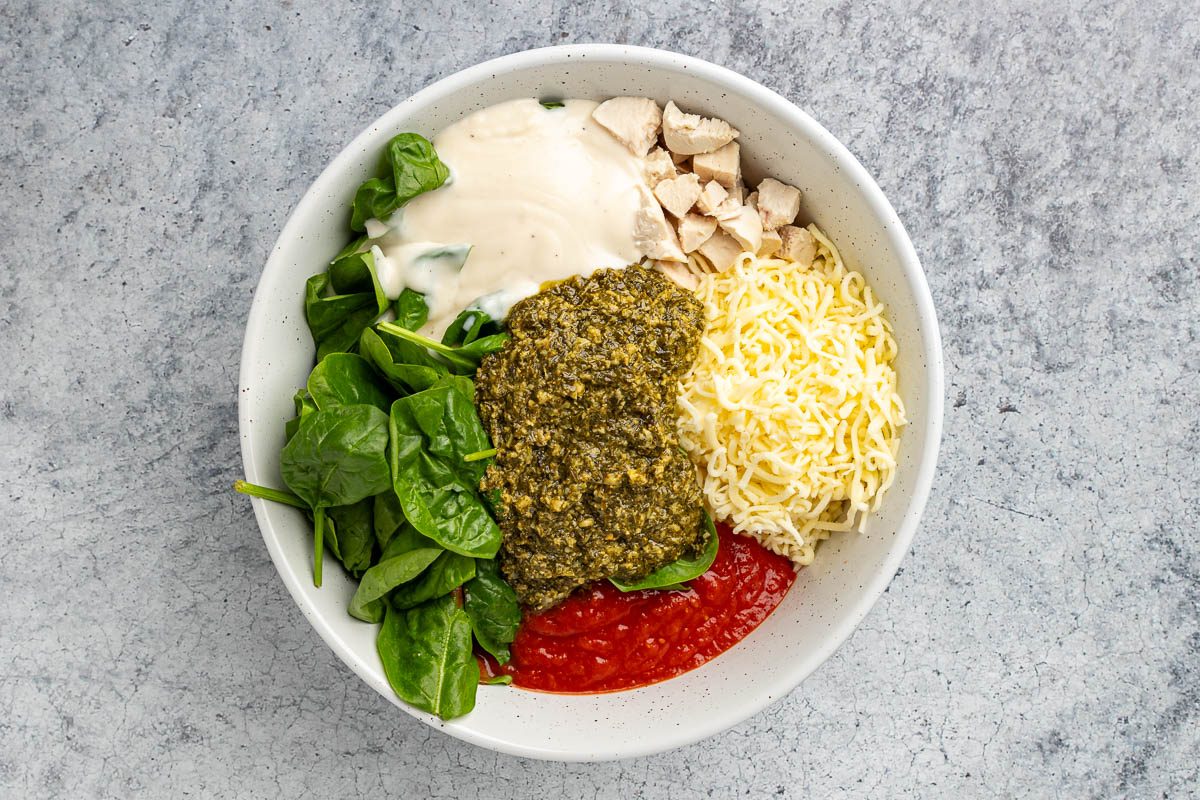 Taste of Home Pesto Chicken Casserole recipe photo of the ingredients in a mixing bowl.