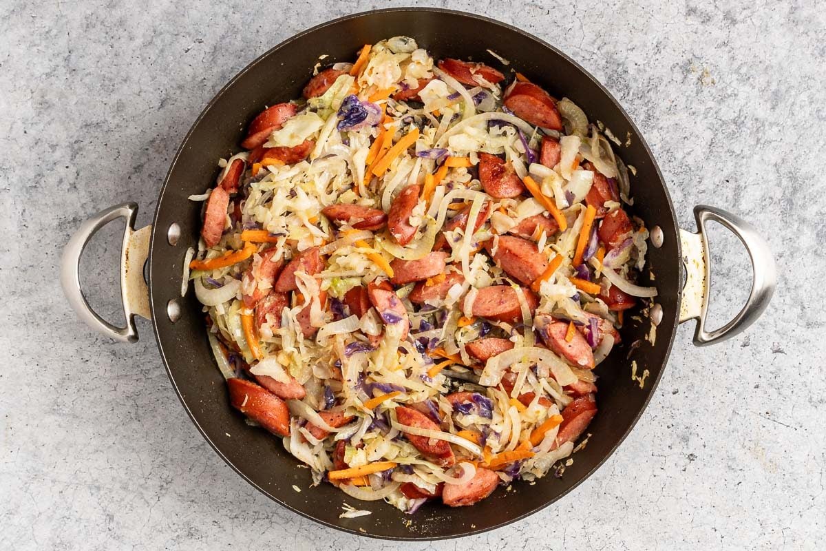 Taste of Home Pierogies and Sausage photo of all the ingredients, minus the pierogi, cooked in a skillet.