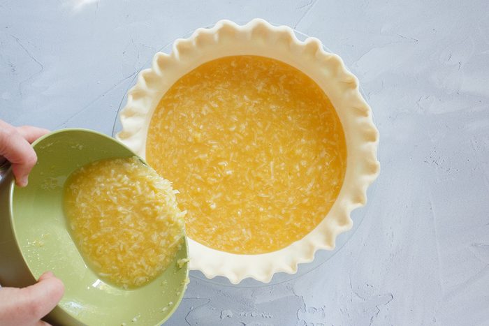 Pouring filling into crust