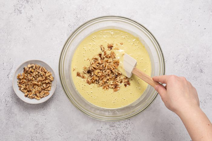 Chopped Walnuts Mixed Inside Pistachio Cake Batter