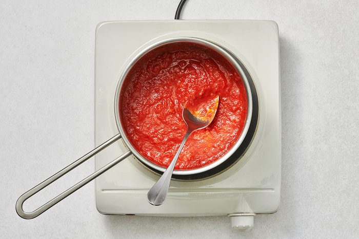 Spaghetti sauce warmed in a small saucepan
