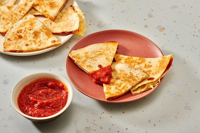 Quesadilla wedges served with spaghetti sauce