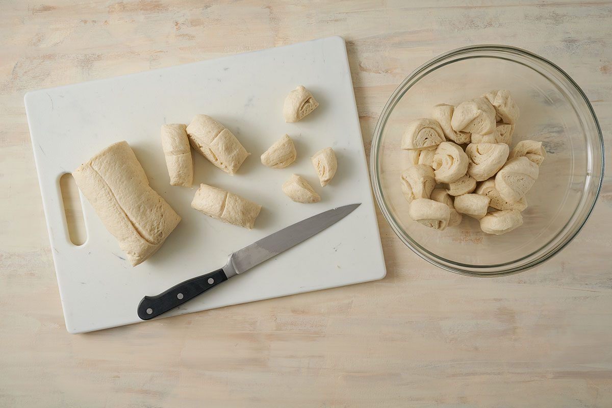 Overhead view of refrigerated pizza dough being prepped for the Taste of Home Pull Apart Pizza recipe.