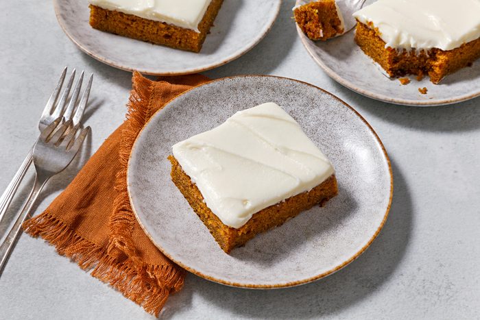 3/4th angle shot of Pumpkin Spice Cake with Cream Cheese Frosting.