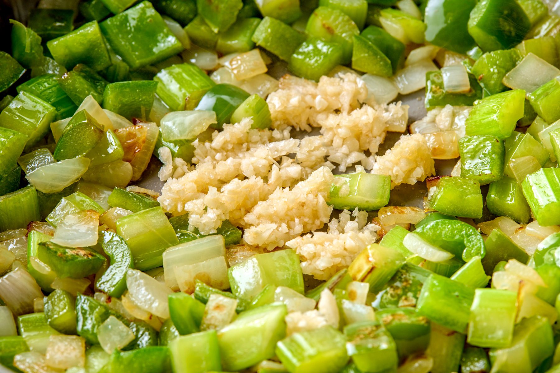 close shot Added garlic; cooking 1 minute longer