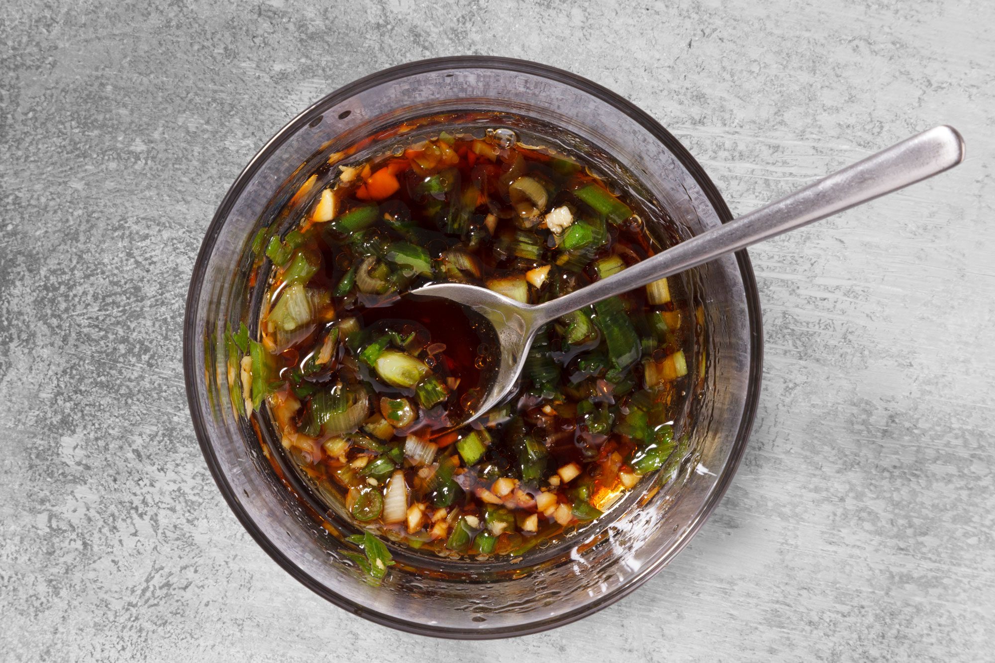 in a small bowl, combine soy sauce, vinegar, sesame oil, green onion, mirin if desired and ginger.