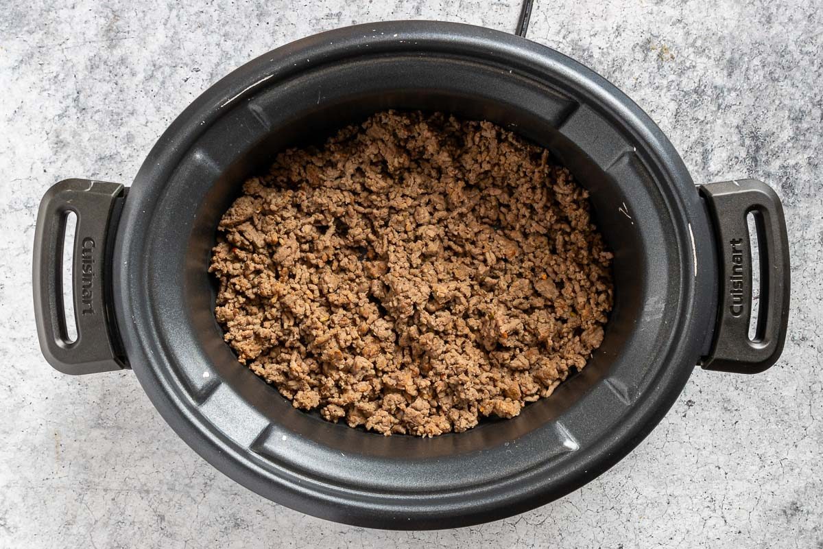 Taste of Home Slow Cooker Cheese Dip photo of the cooked beef and pork in a slow cooker.