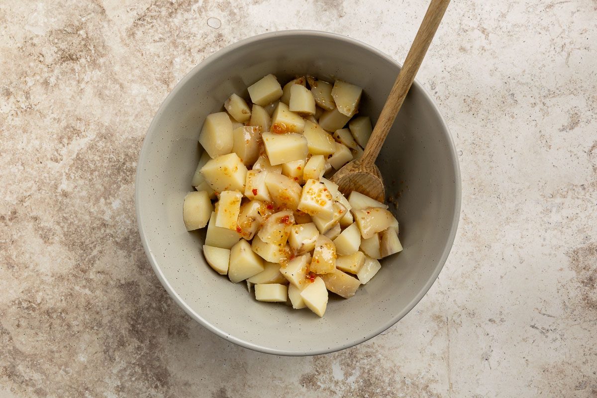 Taste of Home Sour Cream Potato Salad recipe photo of potatoes tossed with italian salad dressing.