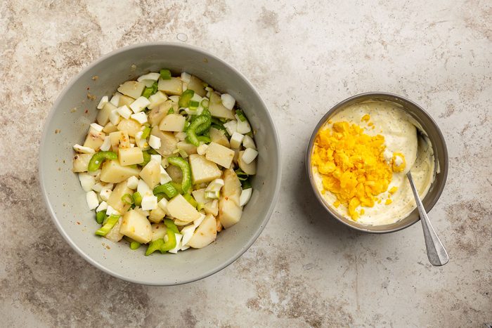 Taste of Home Sour Cream Potato Salad recipe photo of wet ingredients mixed together to coat the potatoes.