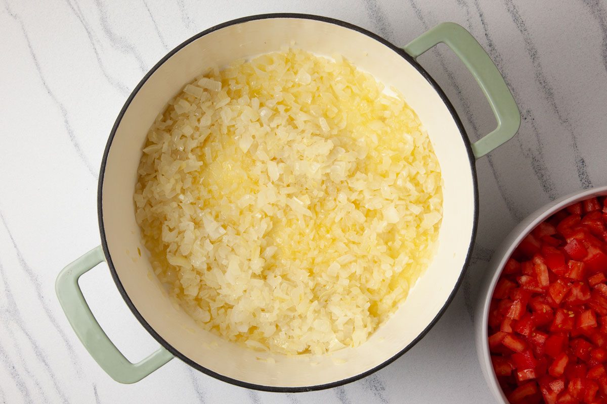 Step 1 of Taste of Home Spaghetti Sauce Without Meat is to cook the onions