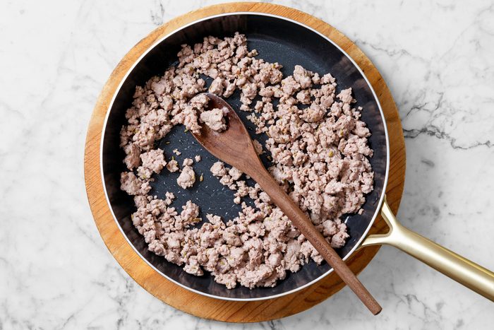 Overhead shot; Meanwhile for stuffing in a large skillet; cook and crumble sausage over medium heat until no longer pink; drain and set aside; spoon; marble surface.