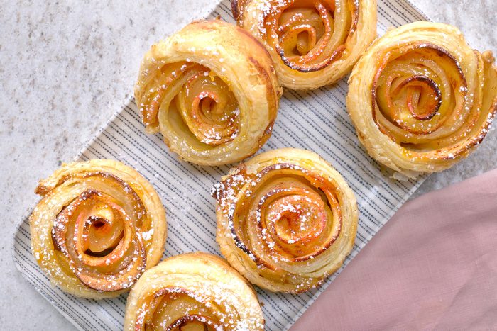 Apple Roses sprinkled with confectioners' sugar
